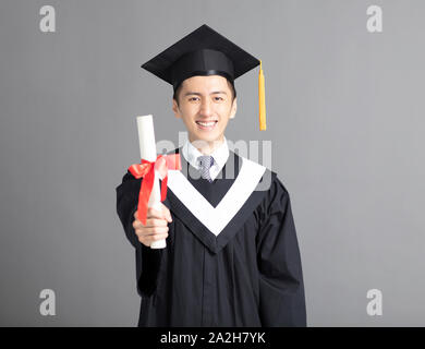 Cheerful young graduated student man isolated Stock Photo