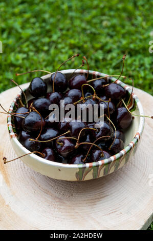 Black cherries in a bowl Stock Photo