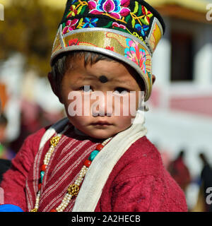 Tawang, Arunachal Pradesh, India - 04 JANUARY 2019: Portrait of the tybetan boy which is wearing the tribal dressed and the beautiful hat. Stock Photo