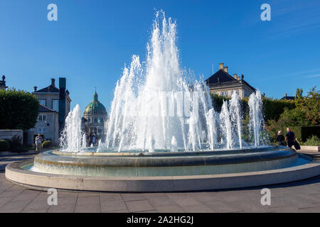 The Amalienborg Palace Royal fountain in sunny day in Copenhagen, Denmark Stock Photo