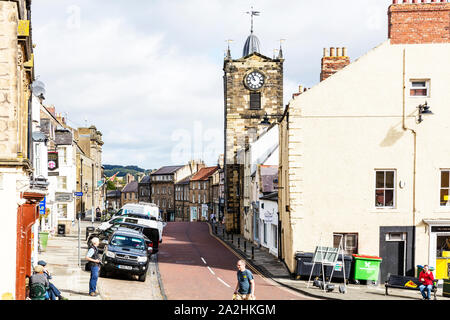 The Town Hall Clock Tower from Fenkle Street in Alnwick Northumberland England, Alnwick Northumberland, Alnwick town Northumberland UK,  Alnwick town Stock Photo