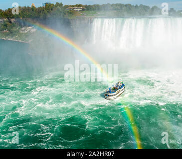 Maid of the Mist under a rainbow at Niagara Falls, Ontario, Canada Stock Photo