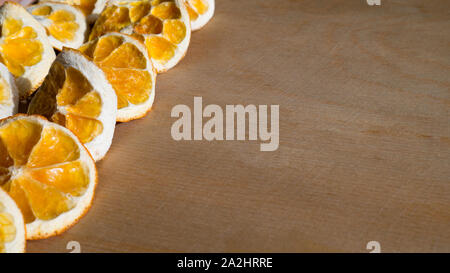 Natural Oranges Dried Sliced on a Wooden Background Stock Photo