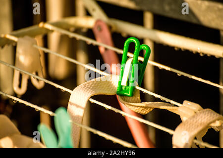 drying rack on a balcony with raindrops Stock Photo