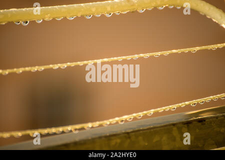 drying rack on a balcony with raindrops Stock Photo