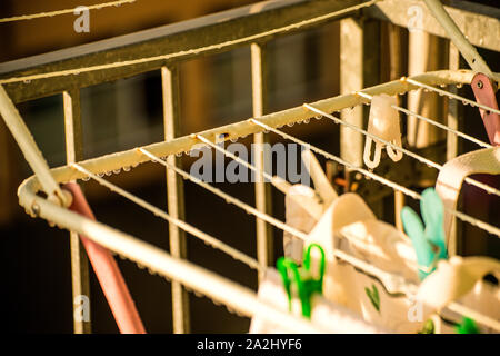 drying rack on a balcony with raindrops Stock Photo