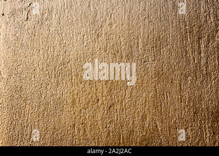 Golden painted wall texture Stock Photo