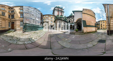 360 degree panoramic view of LVIV, UKRAINE - AUGUST 2019: Full spherical seamless hdri panorama 360 degrees in the yard near old gothic church in equirectangular projection with z