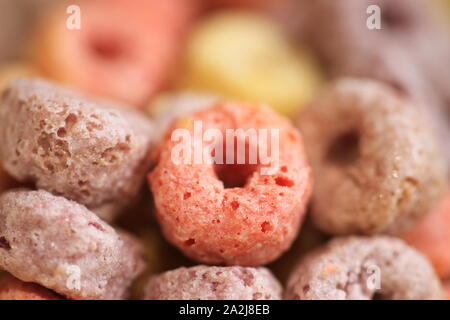Sweet fruit flavored cereals under close up lens. Stock Photo