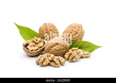 open walnut closeup with leaves on white background Stock Photo