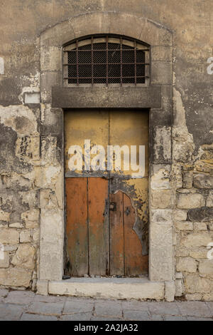 old Italian palace door in ruined wood Stock Photo