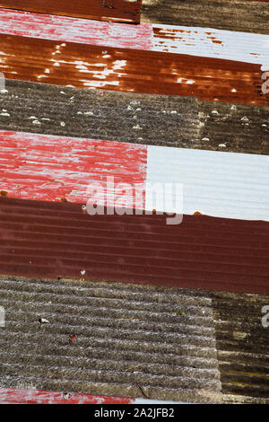 Rusty and multicolored corrugated metal roof. Stock Photo