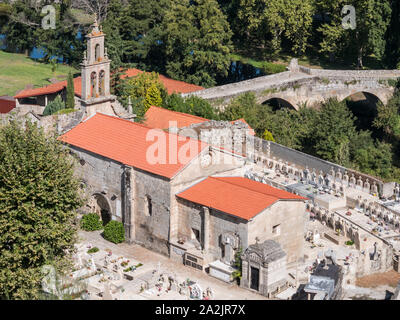 View of St. Mary of Vilanova Church and the romanesque Vilanova bridge in Allariz, province of Ourense, Galicia, Spain Stock Photo