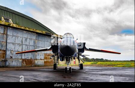 ZA326 Panavia Tornado GR1 in royal aircraft est colours or raspberry ripple as it is affectionately known in front of a hangar under moody skies Stock Photo