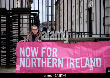 Belfast, Northern Ireland, UK. 3rd October, 2019.  Pro Choice Activist holding banners reading ‘Now for Northern Ireland’ outside the Belfast Royal Courts of Justice where the Belfast High court today.   Credit: JF Pelletier/Alamy Live News. Stock Photo