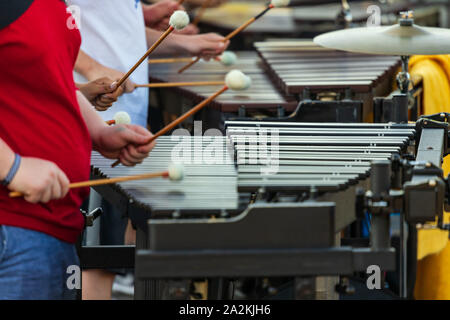 flashing mallets of the sideline percussionists at rehearsal Stock ...