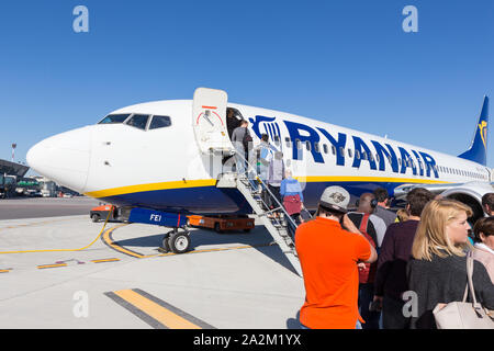 Trieste airport, Italy - 20 April 2018: People boarding Ryanair plane on Friuli Venezia Giulia Airport in Trieste, italy on April 20th, 2018. Ryanair Stock Photo