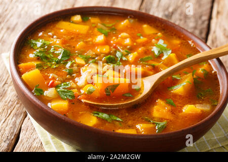 Tasty tomato sweet potato with lentil soup close-up in a bowl on the table. horizontal Stock Photo