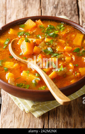 Vegetable vegetarian sweet potato with lentil soup close-up in a bowl on the table. vertical Stock Photo