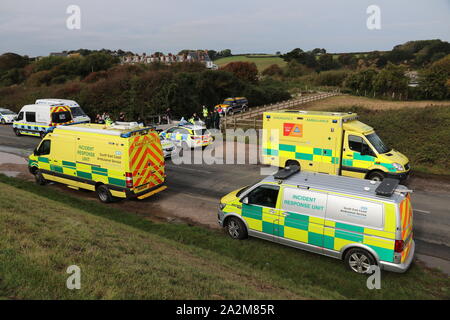 MIGRANTS ARRIVING AT A SOUTH COAST BEACH IN OCTOBER 2019 AND BEING DEALT WITH BY HOME OFFICE IMMIGRATION ENFORCEMENT AND EMERGENCY SERVICES Stock Photo