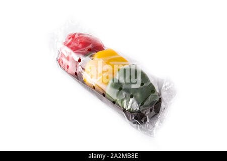 Yellow,red and green peppers packaged in plastic bag isolated on white background Stock Photo