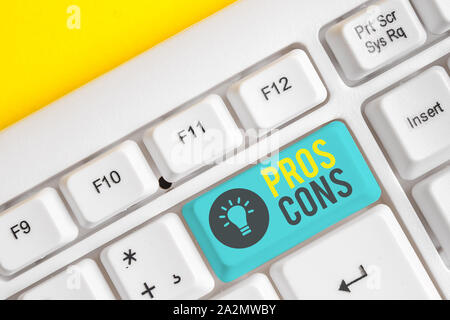 Conceptual hand writing showing Pros Cons. Concept meaning The favorable and unfavorable factors or reasons of demonstrating White pc keyboard with no Stock Photo