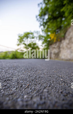 Road from the ground level with bokeh background Stock Photo - Alamy