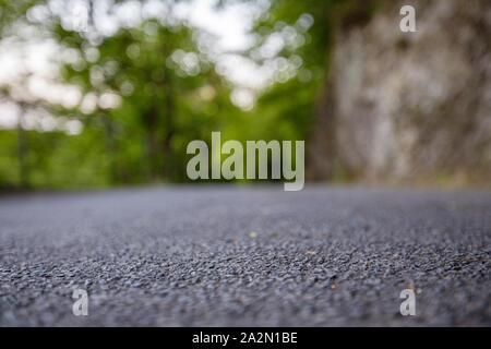 Road from the ground level with bokeh background Stock Photo