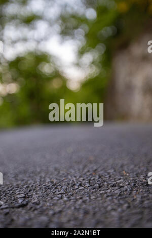 Road from the ground level with bokeh background Stock Photo