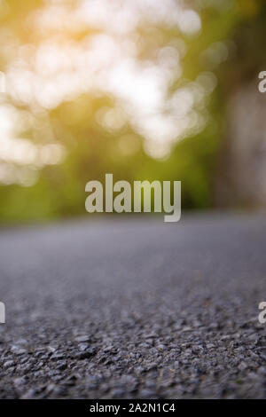 Road from the ground level with bokeh background Stock Photo