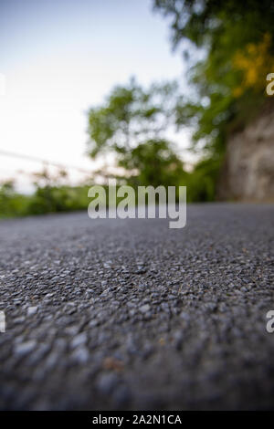 Road from the ground level with bokeh background Stock Photo - Alamy