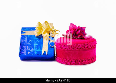 Blue gift box decorated with golden ribbon and pink round gift box with pink ribbon on a white background Stock Photo