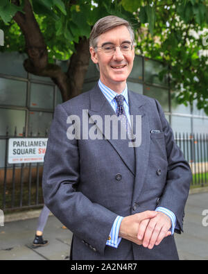 Westminster, London, UK, 03rd Oct 2019. Jacob Rees-Mogg, Leader of the House of Commons, Conservative MP, chats to a passer-by near the Houses of Parliament in London. Credit: Imageplotter/Alamy Live News Stock Photo