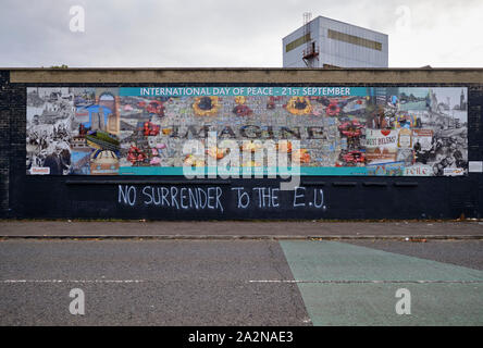 Belfast International wall painting with 'No surrender to the E.U.' graffiti Stock Photo