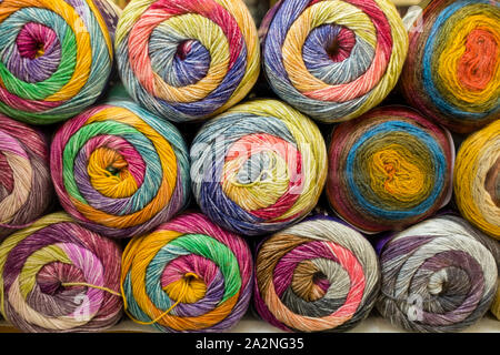 Stacked balls of wool in shop, St Nicholas Market, Bristol, UK Stock Photo