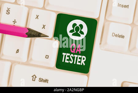 Text sign showing Qa Tester. Business photo text Quality assurance of an on going project before implementation White pc keyboard with empty note pape Stock Photo