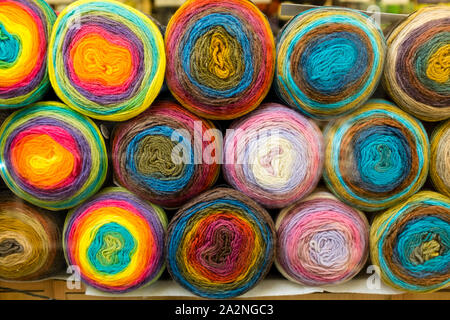 Stacked balls of wool in shop, St Nicholas Market, Bristol, UK Stock Photo