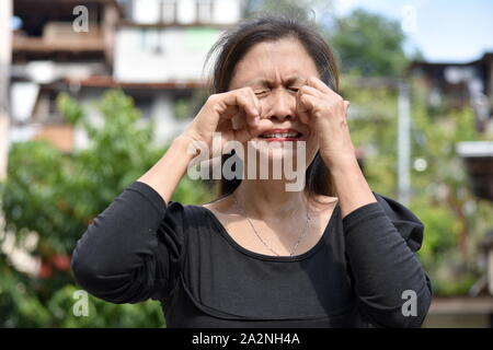 A Crying Female Senior Gramma Stock Photo