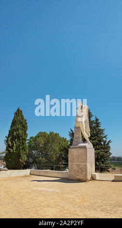 Statue of Trajan in heroic pose at the archaeological ensemble of Italica, old city with a strategic role in the Roman Empire, Santiponce, Seville Stock Photo