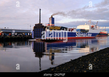 Freight ferry  Stena Scotia arriving in the Port of Belfast loaded with containers with smoke coming from chimney Stock Photo