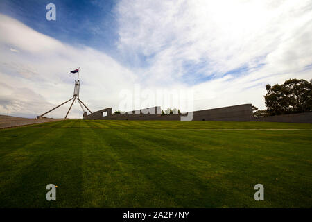 Grass roof of Parliament House, Canberra, Australia. The building was designed by Mitchell - Giurgola & Thorp Architects and built by a Concrete Const Stock Photo