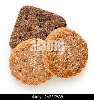 Two round oat wheat flat breads and one square rye flat bread isolated on white. Top view. Stock Photo