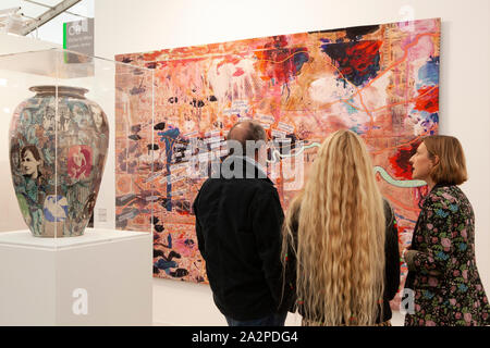 Frieze 2019 art fair takes place in a large marquee in Regent's Park, London. Shown here, a large vase and tapestry by Turner Prize winner Grayson Perry. Stock Photo