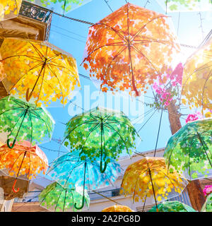 Street decorated with colorful umbrellas on summer sunny day, Stock Photo