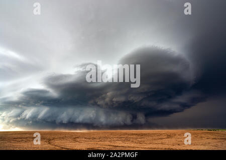 Supercell storm with dramatic clouds over a dusty field near Bethune, Colorado
