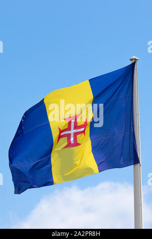 yellow flag with red and white cross