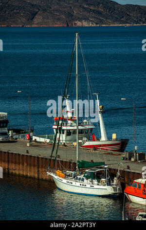 A sailing boat (Altego II) awaiting start of North West Passage journey in Aasiaat (Greenland) in July 2019 Stock Photo