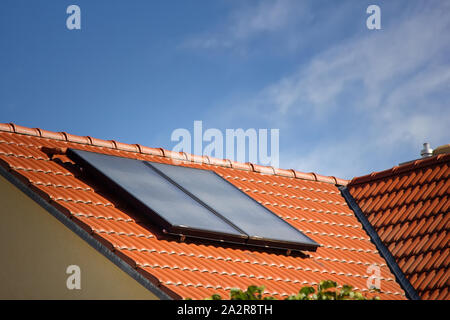 Houses of old construction with new tiled roofs and solar panels Stock Photo