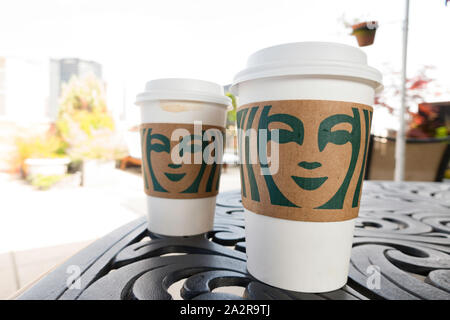 https://l450v.alamy.com/450v/2a2r9tj/starbucks-coffee-to-go-on-a-patio-table-usa-2a2r9tj.jpg