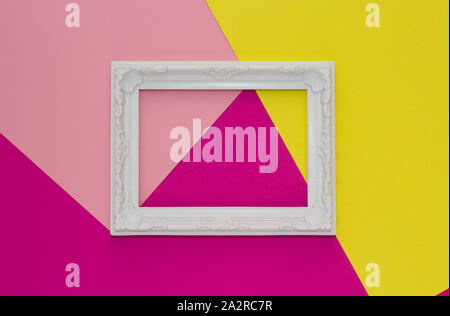 Abstract colored paper minimal background with white frame. Minimal geometric shapes and lines composition with empty picture frame. Stock Photo